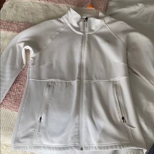 White-North Face zip up jacket